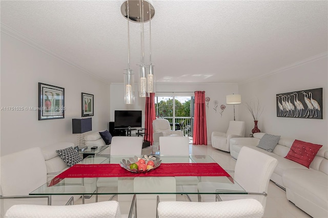 dining area featuring ornamental molding and a textured ceiling