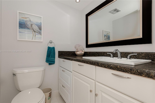 bathroom with toilet, tile patterned flooring, visible vents, and vanity