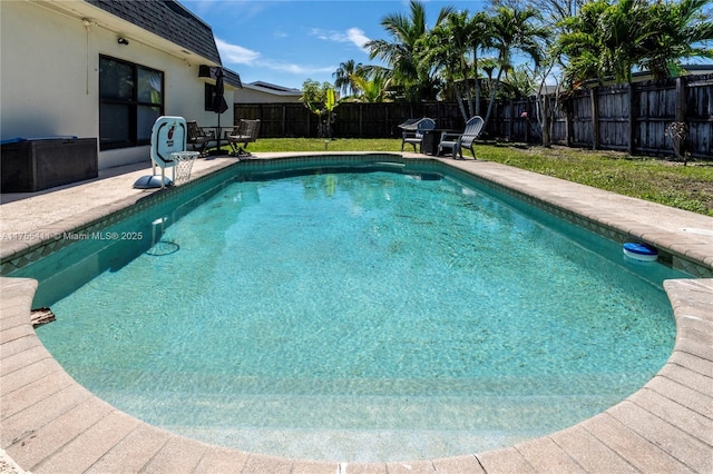 view of pool featuring a patio area, a fenced backyard, and a fenced in pool