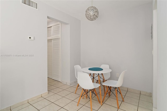 dining area featuring visible vents and tile patterned floors