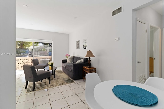 living room with visible vents and light tile patterned flooring