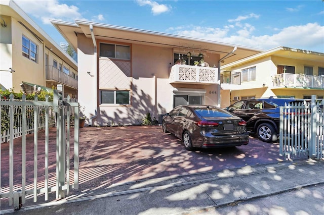 multi unit property with fence and stucco siding