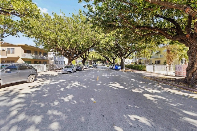 view of road featuring curbs and a residential view