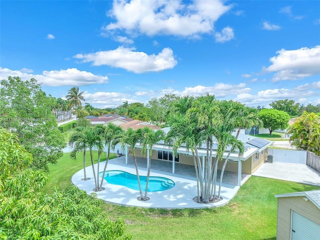 view of pool with a fenced backyard, a fenced in pool, a lawn, and a patio