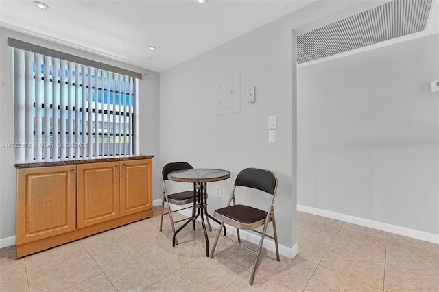 living area with light tile patterned floors, recessed lighting, and baseboards