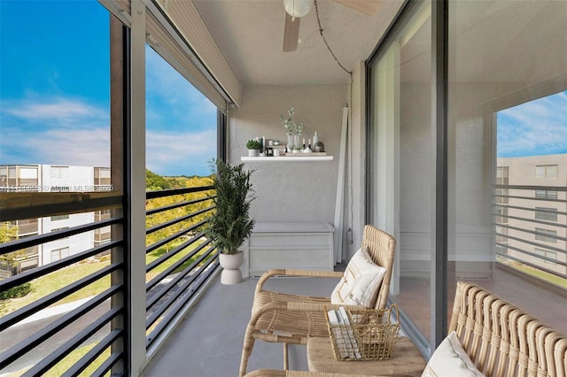 balcony featuring a ceiling fan and radiator heating unit