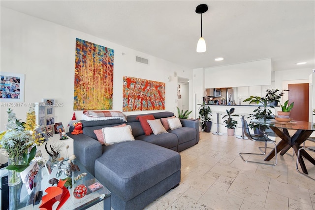 living room featuring visible vents and recessed lighting