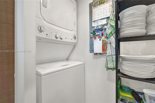 laundry room featuring stacked washer and clothes dryer and laundry area