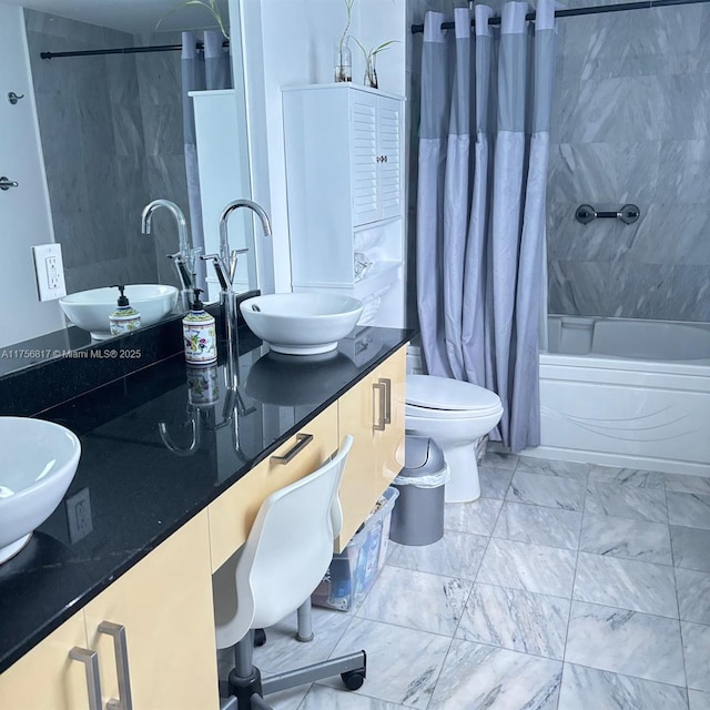 full bath featuring toilet, marble finish floor, shower / bath combo, and vanity