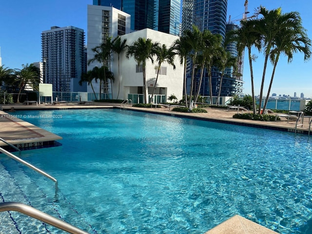 community pool with a city view