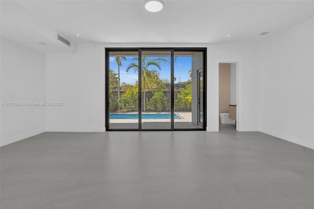 empty room featuring visible vents and baseboards