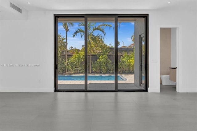 interior space with visible vents, plenty of natural light, and baseboards