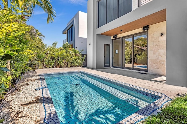 outdoor pool featuring a patio area