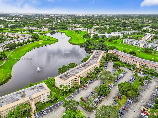 drone / aerial view featuring a water view and golf course view