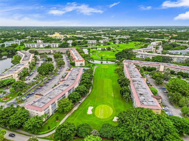 bird's eye view with view of golf course and a water view