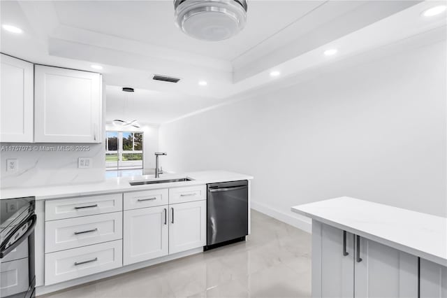 kitchen with a sink, white cabinets, light countertops, range, and dishwasher