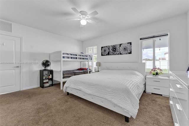 bedroom featuring ceiling fan, visible vents, and carpet flooring