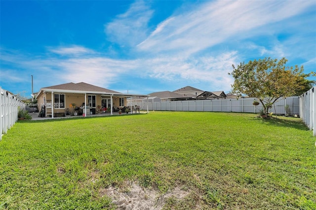 view of yard featuring a patio area and a fenced backyard