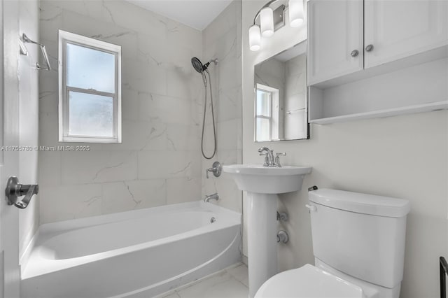 full bath featuring marble finish floor, shower / bath combination, and toilet