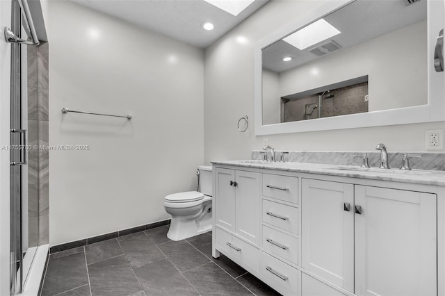 full bath with visible vents, a sink, a shower stall, and toilet