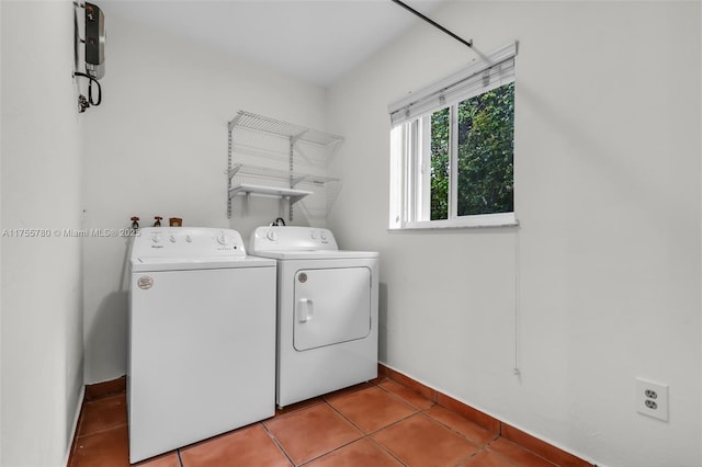 laundry room with washer and dryer, laundry area, tile patterned flooring, and baseboards