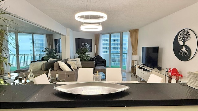 interior space featuring floor to ceiling windows and a textured ceiling