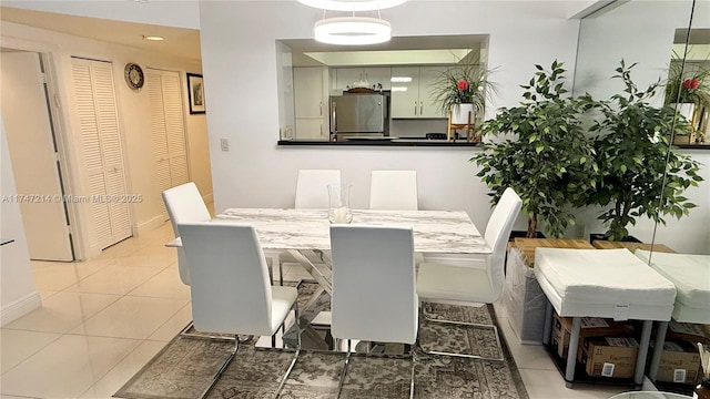 dining room with light tile patterned flooring