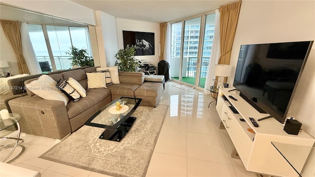 tiled living area featuring floor to ceiling windows