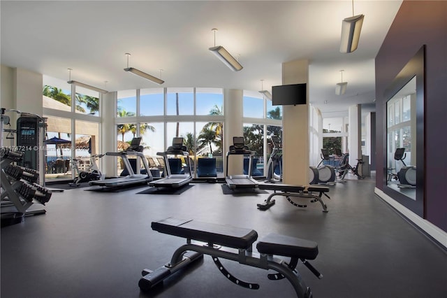 exercise room with floor to ceiling windows