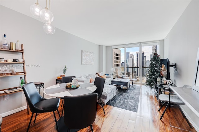 55 SE 6th St Unit 3106, Miami, FL 33131 - dining room featuring wood finished floors and expansive windows