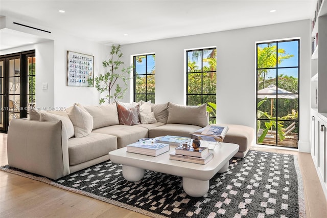 living area featuring recessed lighting and wood finished floors