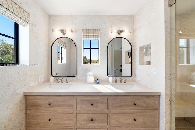 bathroom featuring double vanity and a sink