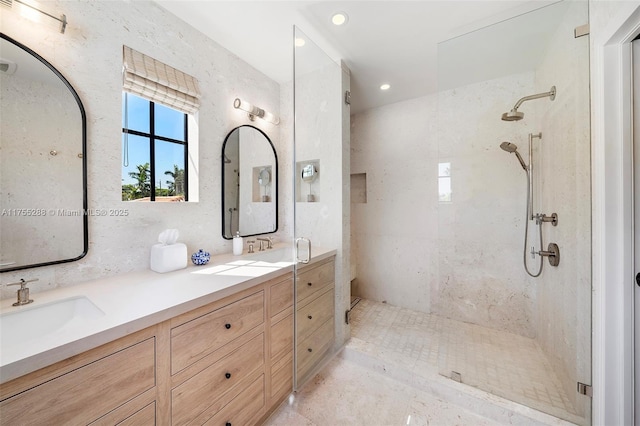 full bathroom featuring double vanity, a walk in shower, a sink, and recessed lighting