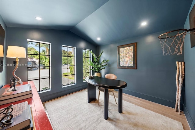 office with vaulted ceiling, plenty of natural light, baseboards, and wood finished floors