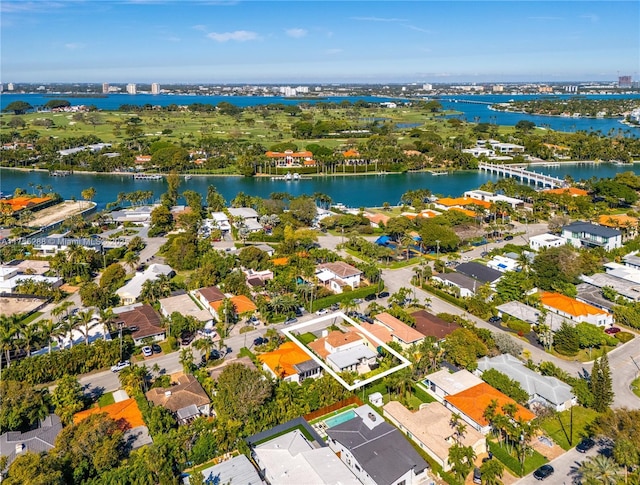 birds eye view of property with a residential view and a water view