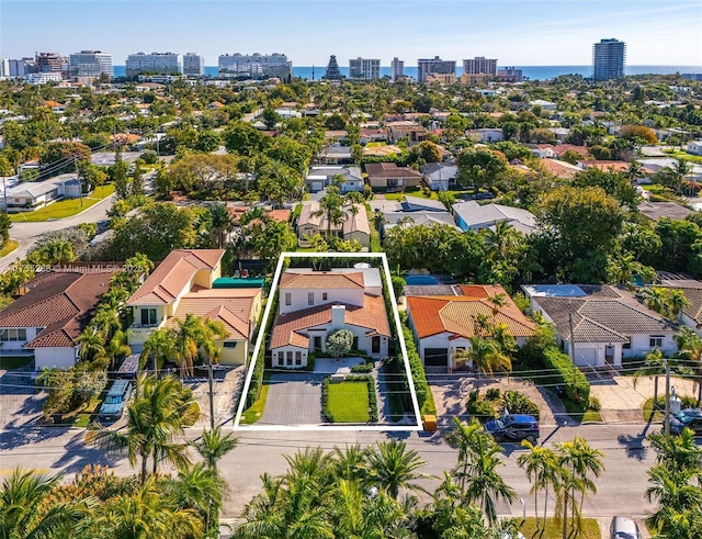 birds eye view of property with a view of city