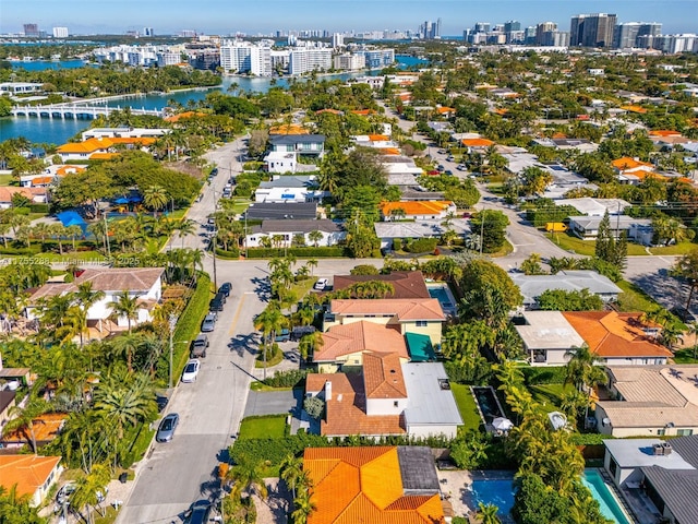 drone / aerial view featuring a water view and a city view