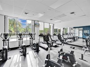 workout area featuring a drop ceiling and visible vents