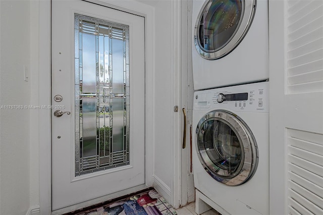 laundry area with stacked washer and dryer