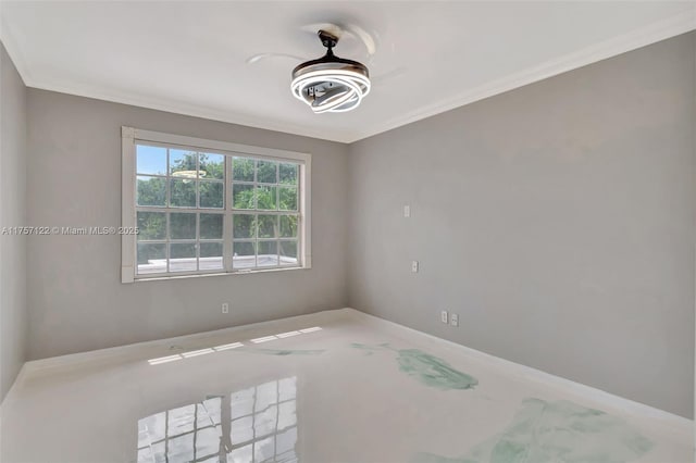 unfurnished room with a ceiling fan and ornamental molding