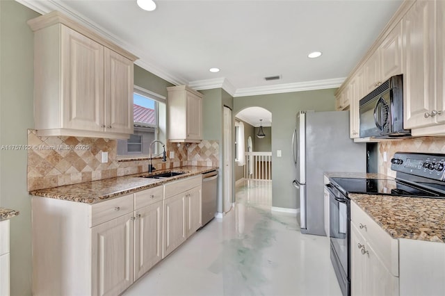 kitchen featuring arched walkways, electric stove, stainless steel dishwasher, black microwave, and a sink