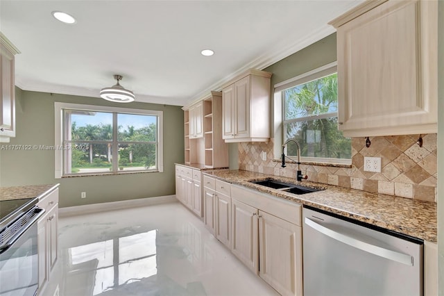 kitchen featuring stainless steel dishwasher, a sink, a wealth of natural light, and crown molding