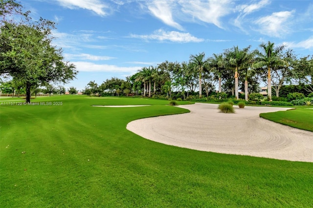 view of home's community with golf course view and a lawn