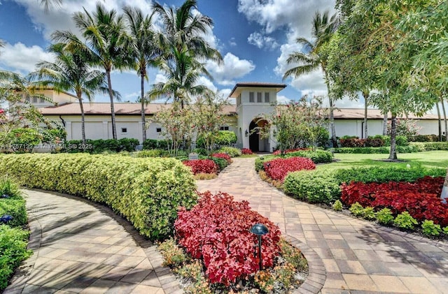 mediterranean / spanish-style home with stucco siding