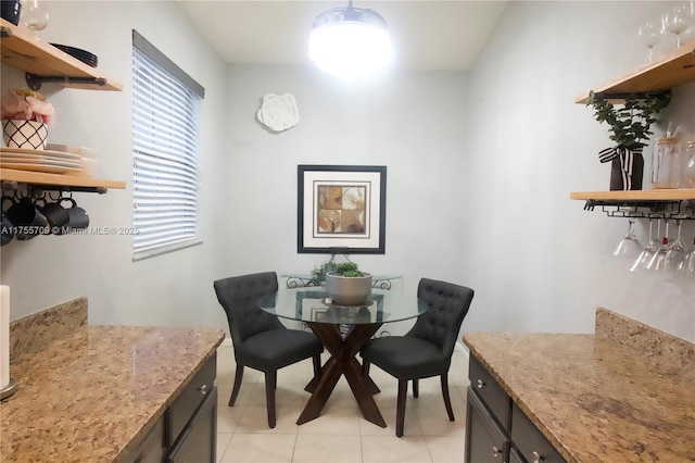 dining space with light tile patterned flooring