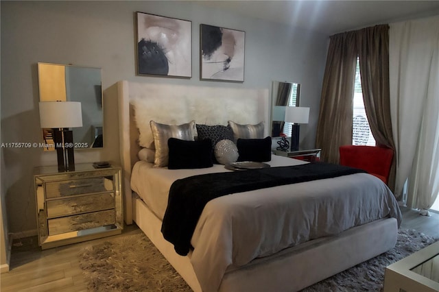 bedroom featuring wood finished floors