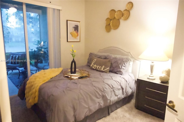 bedroom featuring carpet floors and access to exterior