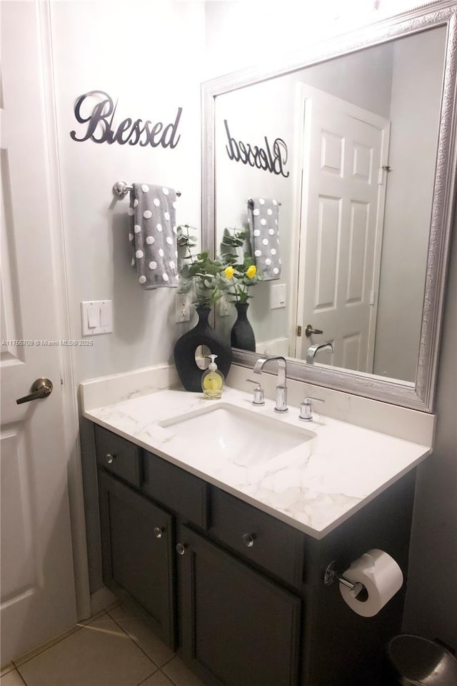 bathroom featuring tile patterned flooring and vanity