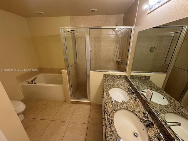 full bathroom featuring a stall shower, a sink, a bath, and tile patterned floors