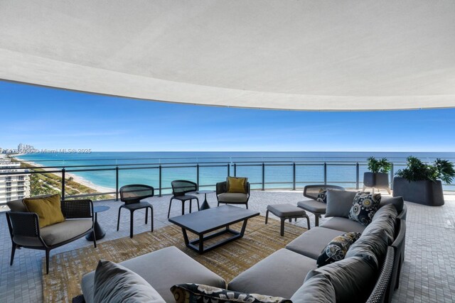 balcony featuring a water view and outdoor lounge area